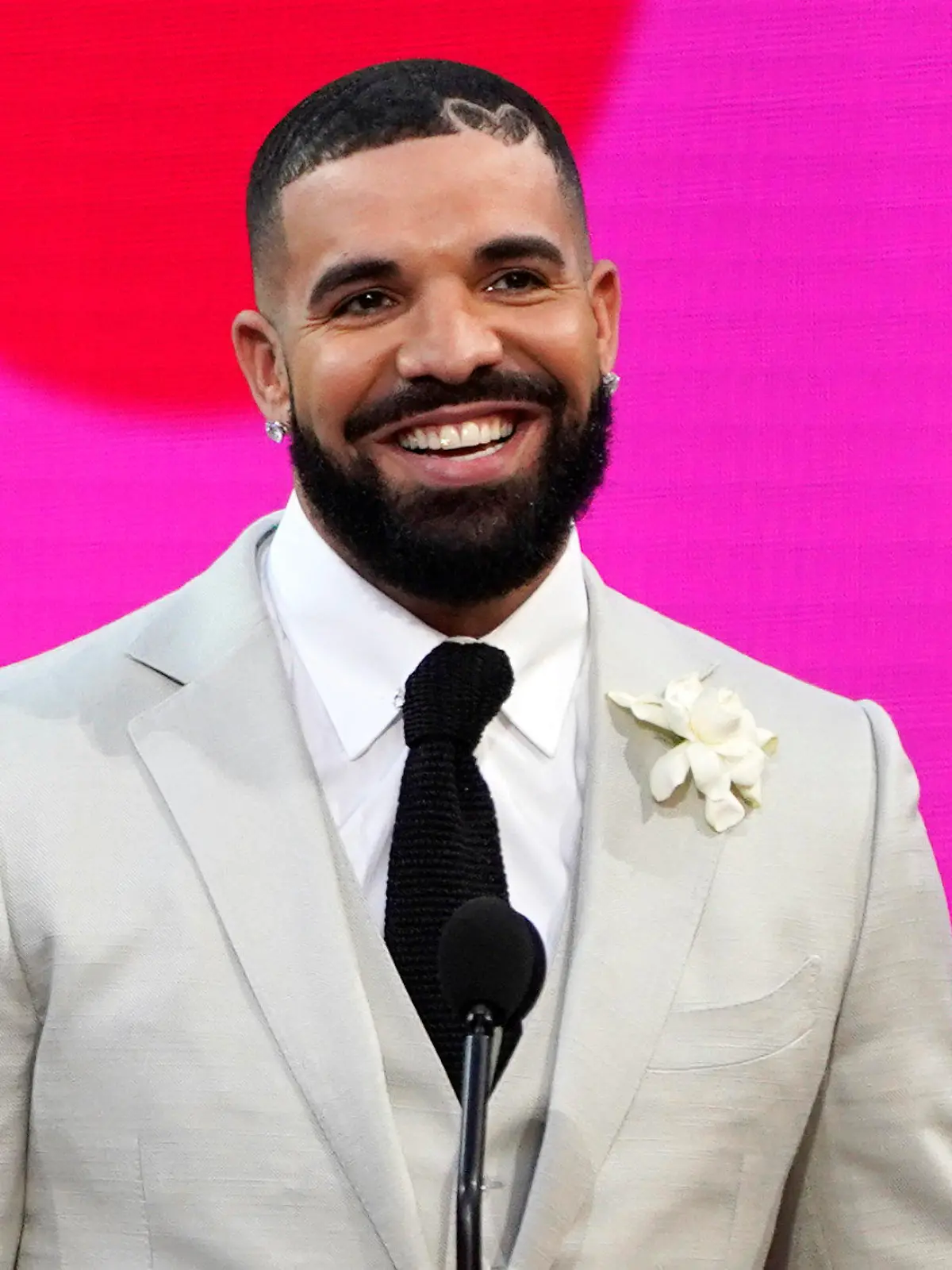 FILE - Drake appears at the Billboard Music Awards n Los Angeles on May 23, 2021. TikTok may look (or sound) a little different when you scroll through the app going forward. Earlier this week, Universal Music Group — which represents big-name artists like Taylor Swift, Bad Bunny and Drake — said that it would no longer allow its music on TikTok following the expiration of a licensing deal between the two companies, Wednesday, Jan. 31, 2024. Now, the takedown of UMG-related music has begun, ByteDance-owned TikTok confirmed to The Associated Press. As of early Thursday, a vast roster of popular songs were disappearing from the social media platform’s library. (AP Photo/Chris Pizzello, File)