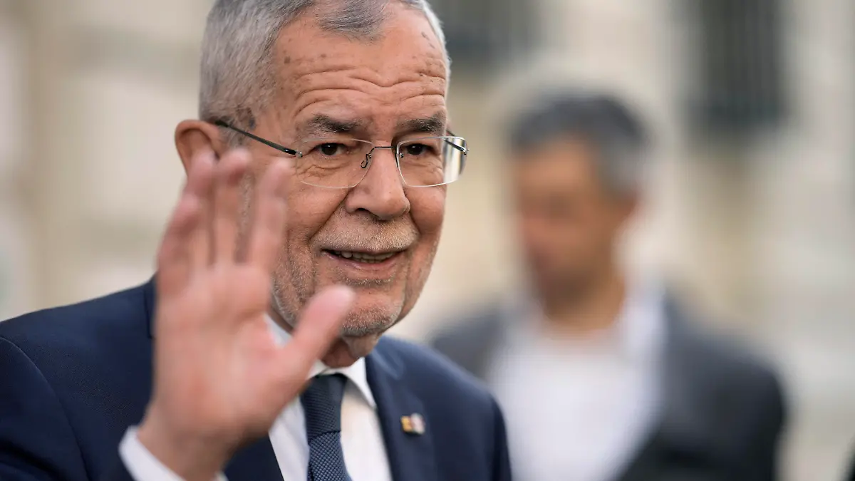 Austrian President Alexander Van der Bellen waves after casting his vote for the Austrian Presidential election in Vienna, Austria, Sunday, Oct. 9, 2022. Austria's liberal president is hoping to be re-elected on Sunday without the need for a runoff vote after a campaign in which he has cast himself as the stable option in uncertain times. (AP Photo/Markus Schreiber)