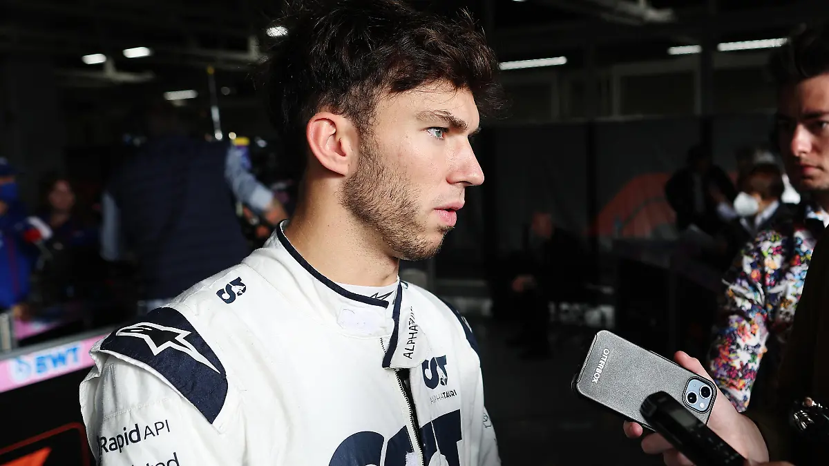 SUZUKA, JAPAN - OCTOBER 08: Seventeenth placed qualifier Pierre Gasly of France and Scuderia AlphaTauri talks to the media in the Paddock during qualifying ahead of the F1 Grand Prix of Japan at Suzuka International Racing Course on October 08, 2022 in Suzuka, Japan. (Photo by Peter Fox/Getty Images )