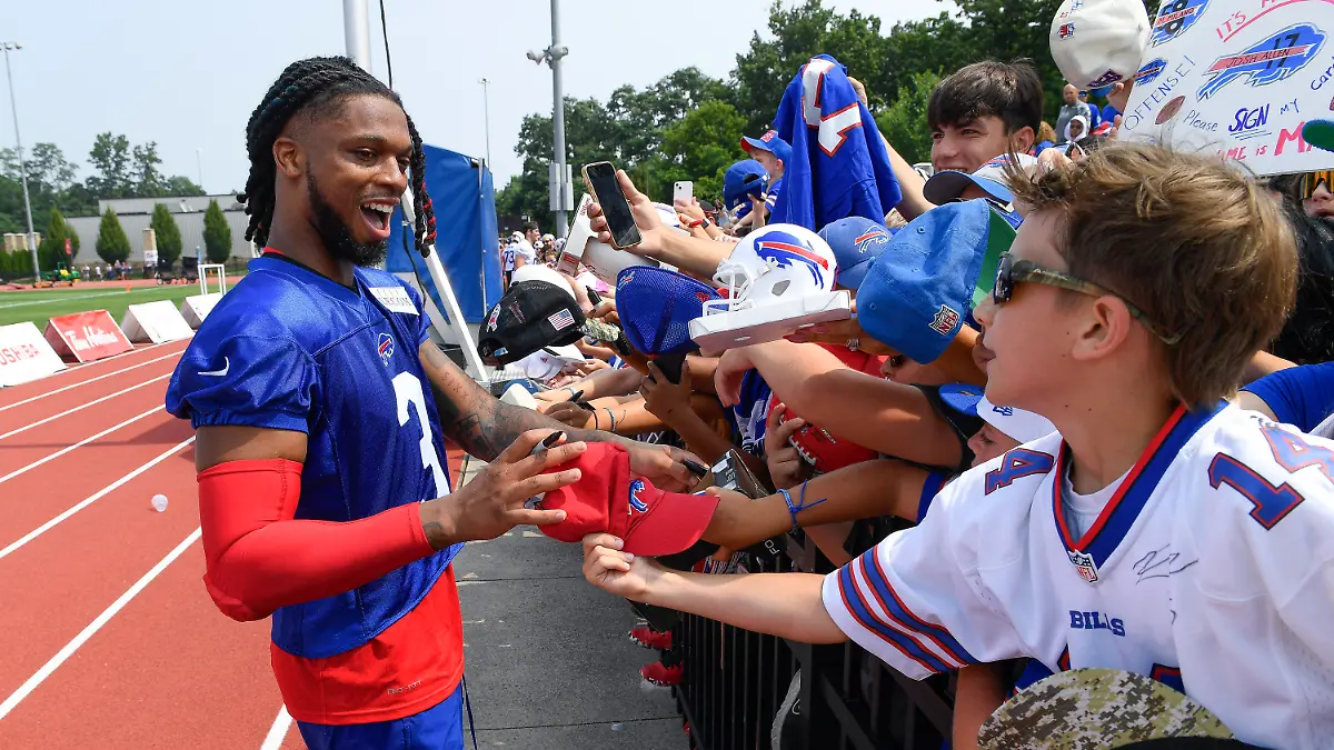 Buffalo Bills safety Damar Hamlin signs autographs after practice at the NFL football team's training camp in Pittsford, N.Y., Wednesday, July 26, 2023. (AP Photo/Adrian Kraus)