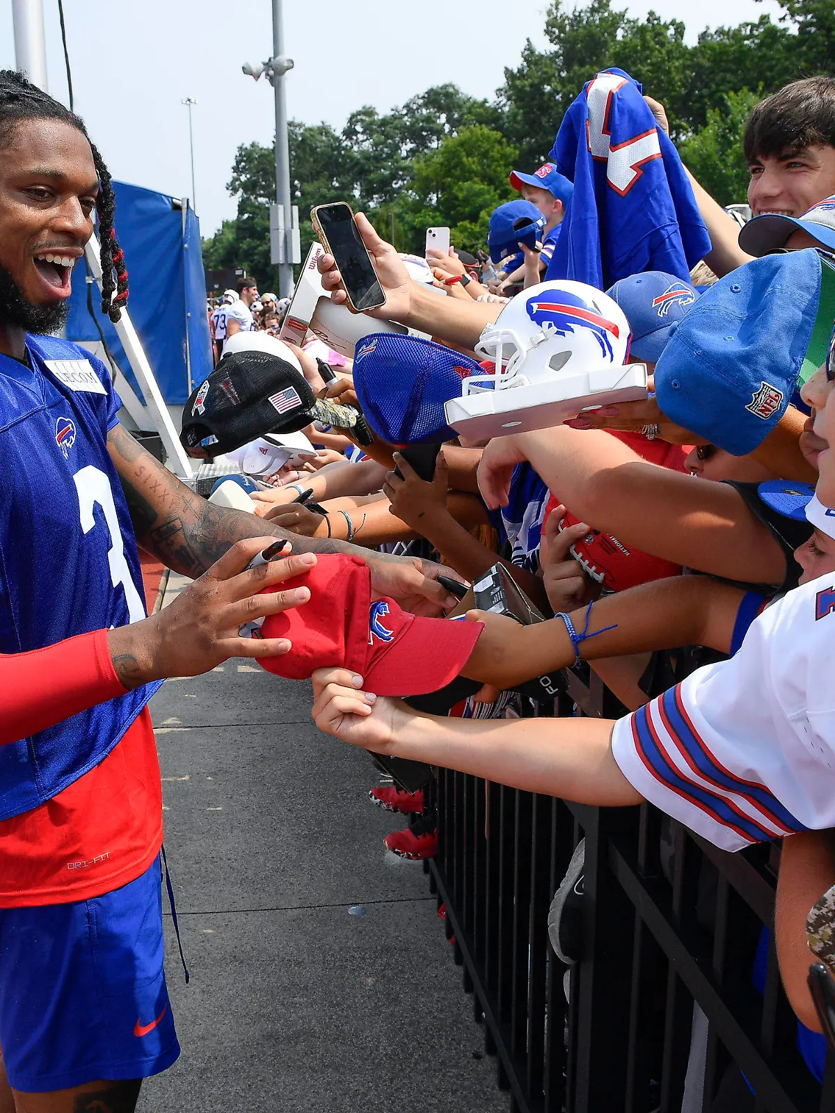 Buffalo Bills safety Damar Hamlin signs autographs after practice at the NFL football team's training camp in Pittsford, N.Y., Wednesday, July 26, 2023. (AP Photo/Adrian Kraus)