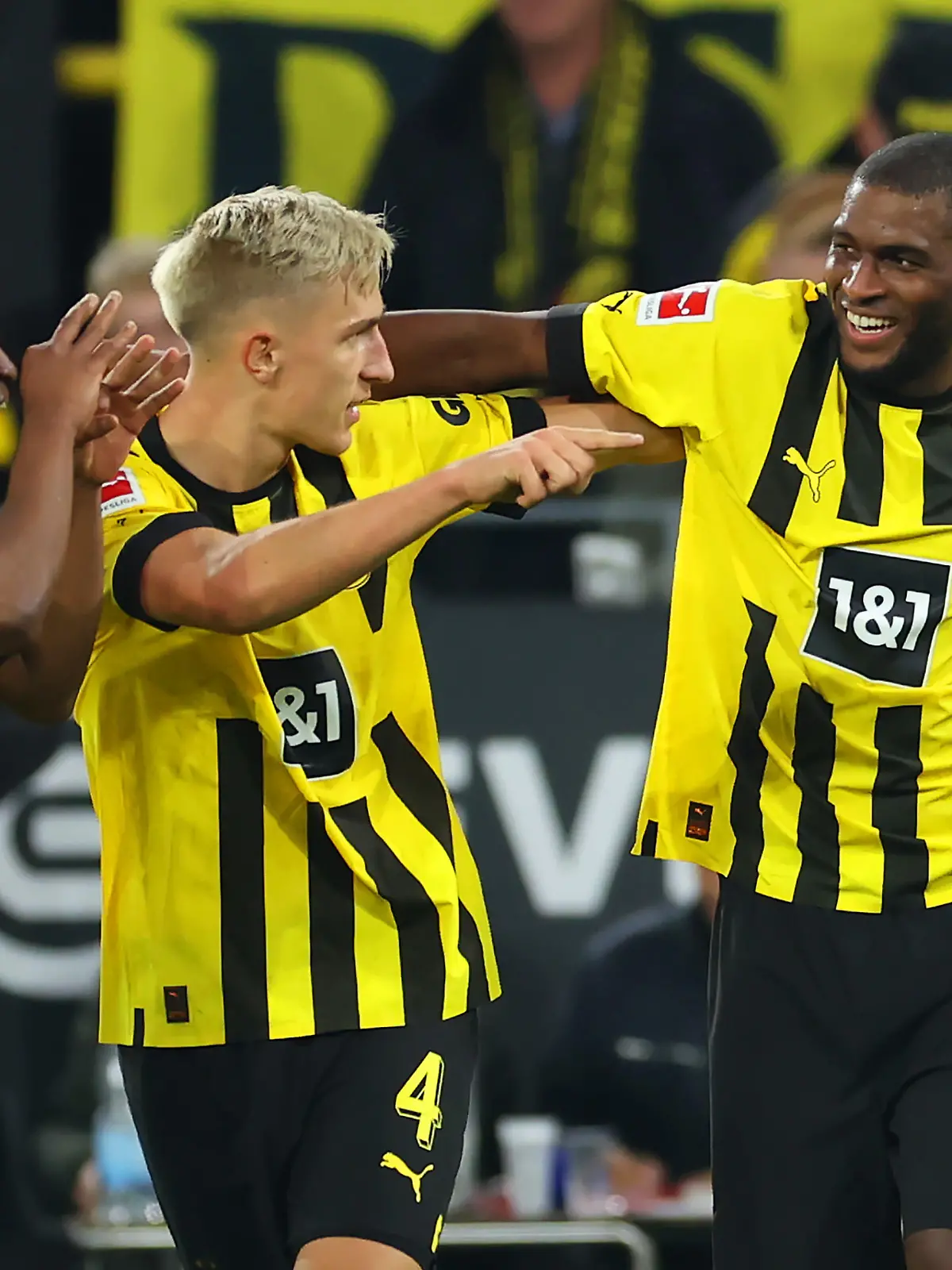 DORTMUND, GERMANY - OCTOBER 08: Anthony Modeste of Borussia Dortmund celebrates with teammates after scoring their team's second goal during the Bundesliga match between Borussia Dortmund and FC Bayern Muenchen at Signal Iduna Park on October 08, 2022 in Dortmund, Germany. (Photo by Alex Grimm/Getty Images)