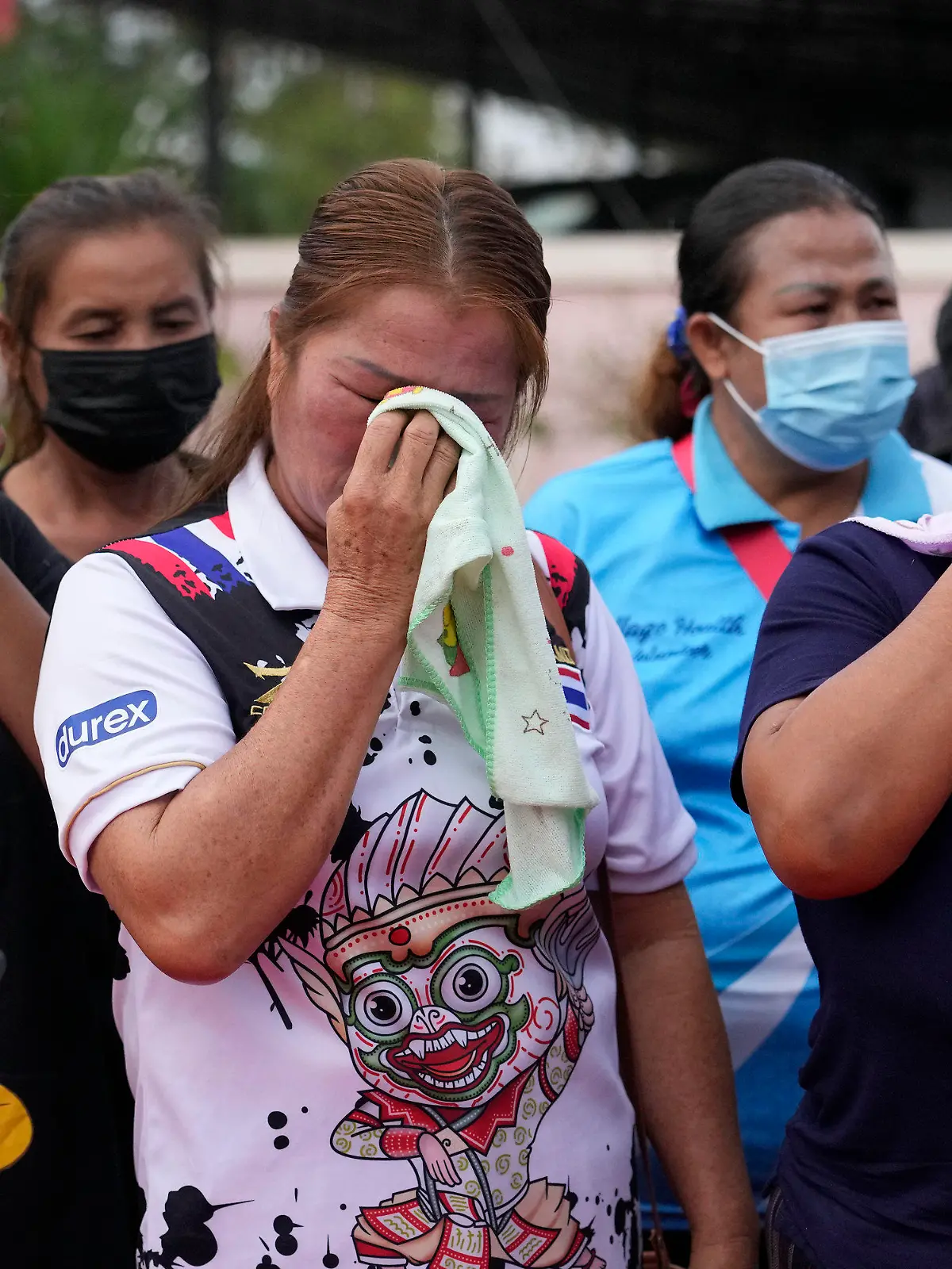 Relatives and friends mourn during a ceremony for those killed in the attack on the Young Children's Development Center in the rural town of Uthai Sawan, north eastern Thailand, Friday, Oct. 7, 2022. A former policeman facing a drug charge burst into a day care center in northeastern Thailand on Thursday, killing dozens of preschoolers and teachers before shooting more people as he fled in the deadliest rampage in the nation's history. (AP Photo/Sakchai Lalit)