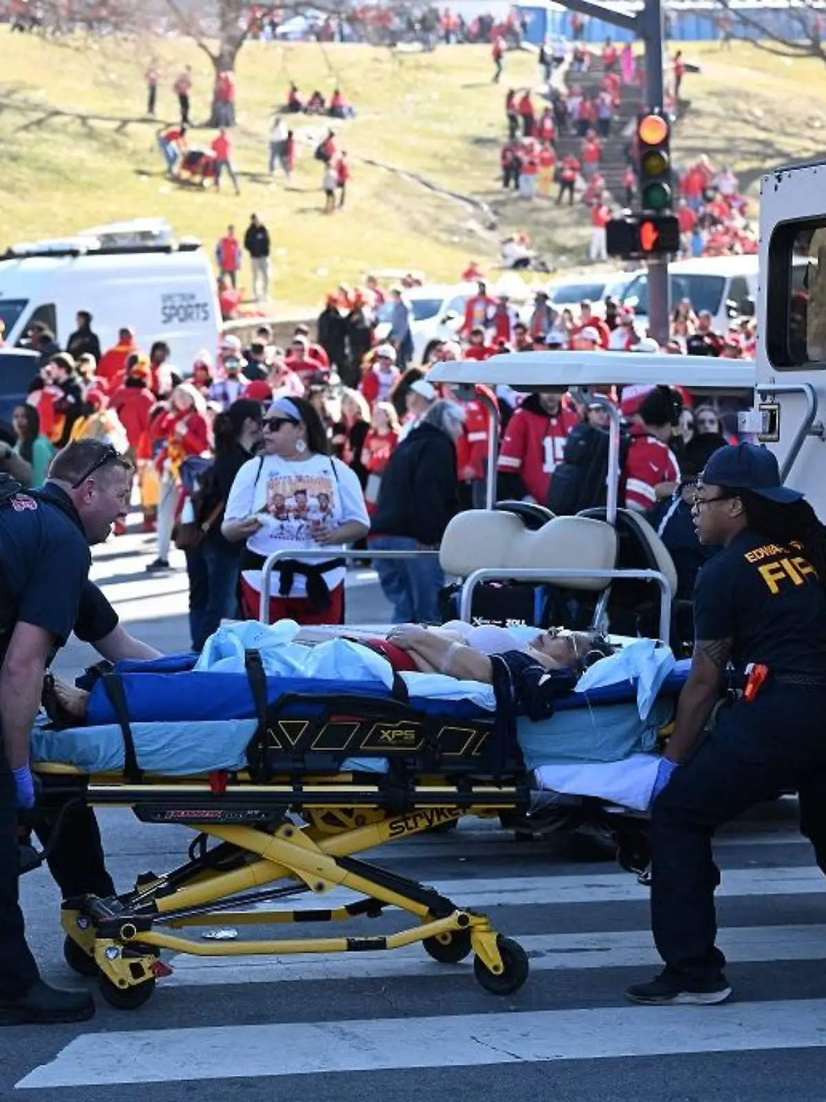 TOPSHOT - An injured person is loaded on an ambulance near the Kansas City Chiefs' Super Bowl LVIII victory parade on February 14, 2024, in Kansas City, Missouri. Shots were reportedly fired during the parade, according to police. (Photo by ANDREW CABALLERO-REYNOLDS / AFP) (Photo by ANDREW CABALLERO-REYNOLDS/AFP via Getty Images)