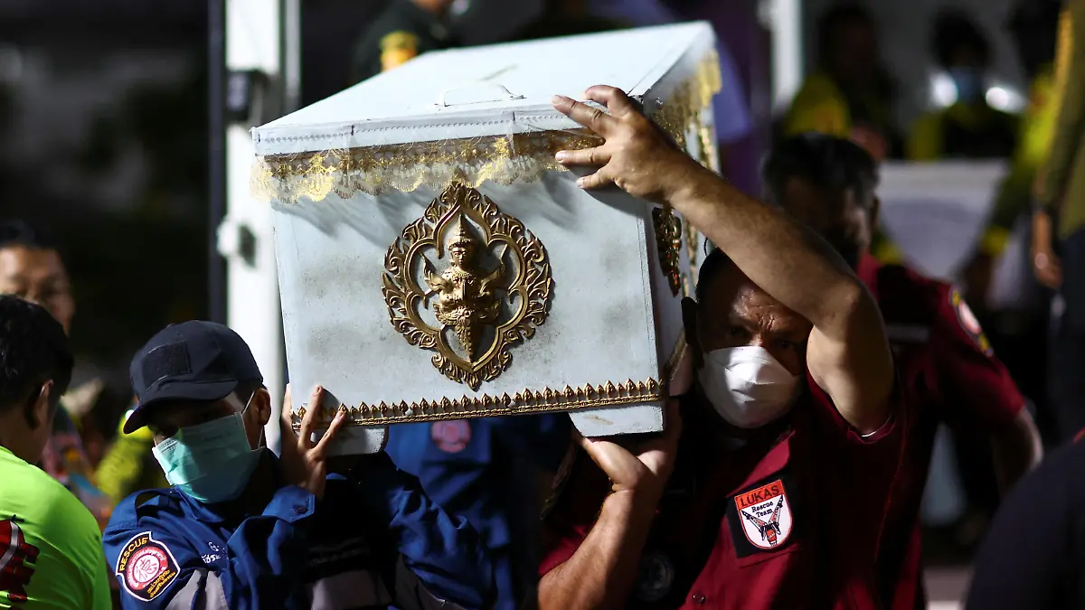 Rescue workers carry a coffin containing the body of a victim at Udon Thani hospital in Udon Thani province, following a mass shooting in the town of Uthai Sawan, around 500 km northeast of Bangkok in the province of Nong Bua Lam Phu, Thailand October 7, 2022. REUTERS/Athit Perawongmetha