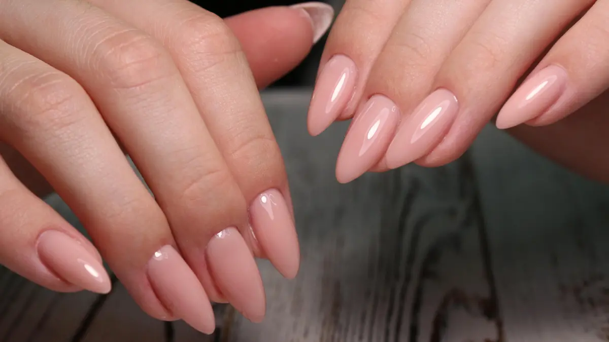 Multi-colored pastel manicure combined tone on tone with a striped background.Nail art