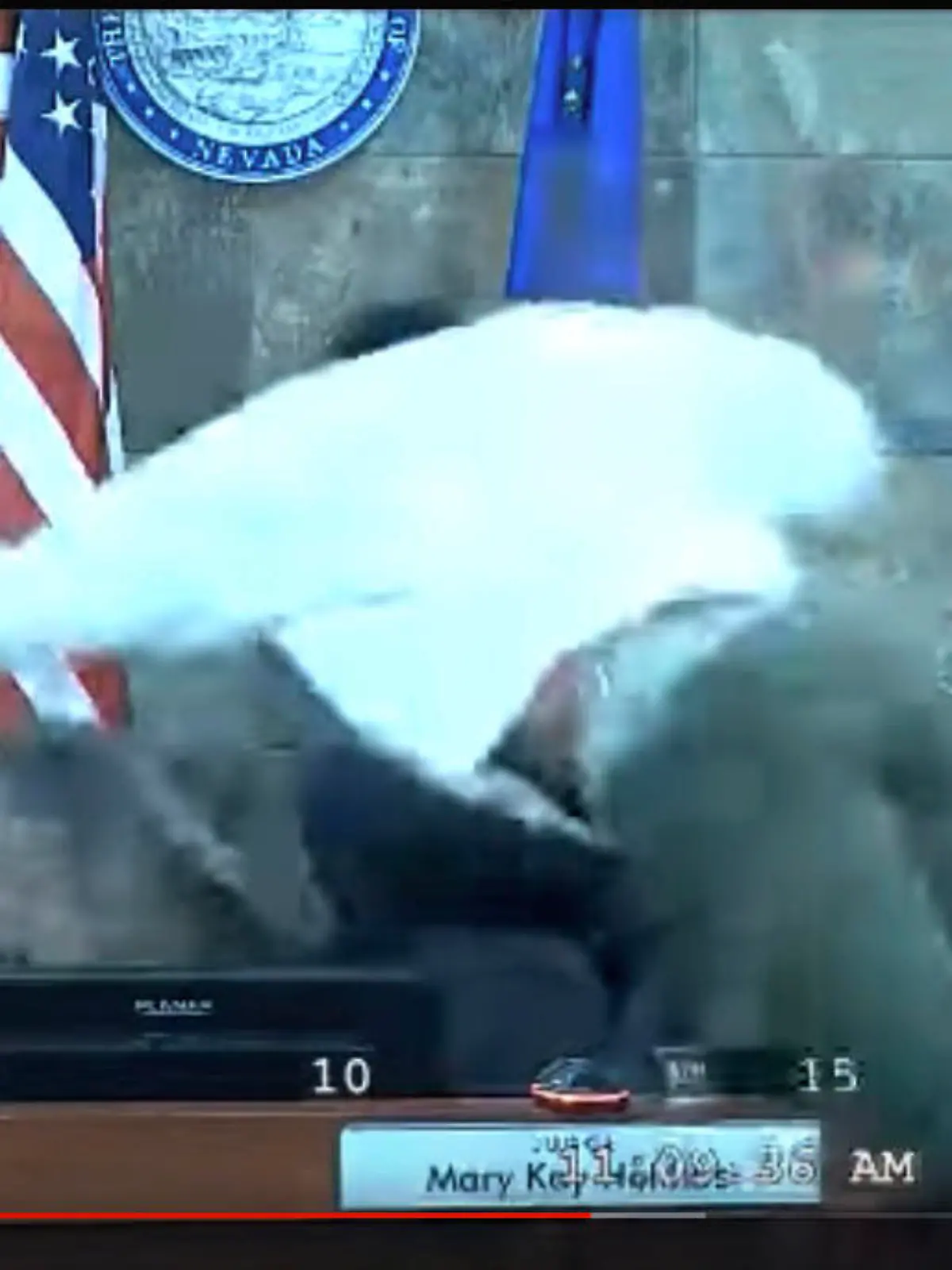 In this image from video provided by the Clark County District Court, a defendant identified by court officials and records as Deobra Redden is seen launching over the desk of Judge Mary Kay Holthus during his sentencing in a felony battery case on Wednesday, Jan. 3, 2024 in Las Vegas.  Redden has now been indicted by a grand jury for attempted murder Thursday, Feb. 8.. (Clark County District Court via AP)