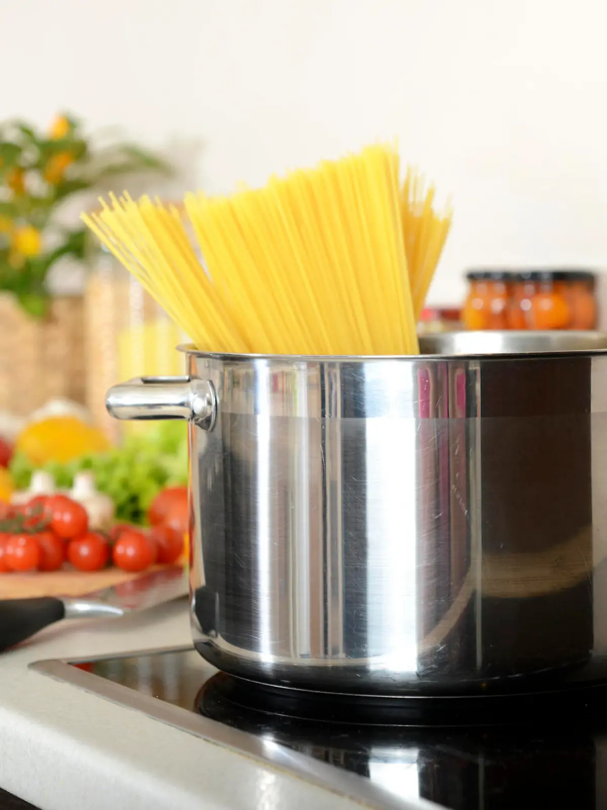 spaghetti in a pan on the stove