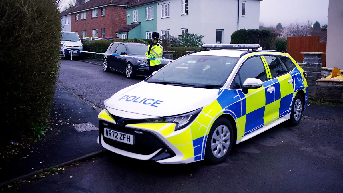 Police work at the scene in Blaise Walk, in Sea Mills, Bristol, England, where a woman has been arrested on suspicion of murder after three children were found dead at a property, Sunday, Feb. 18, 2024. he Avon and Somerset Police force said officers were called to a house in the Sea Mills area of Bristol shortly after midnight and found the three children inside. It said a 42-year-old woman is in police custody at a hospital. (Ben Birchall/PA via AP)