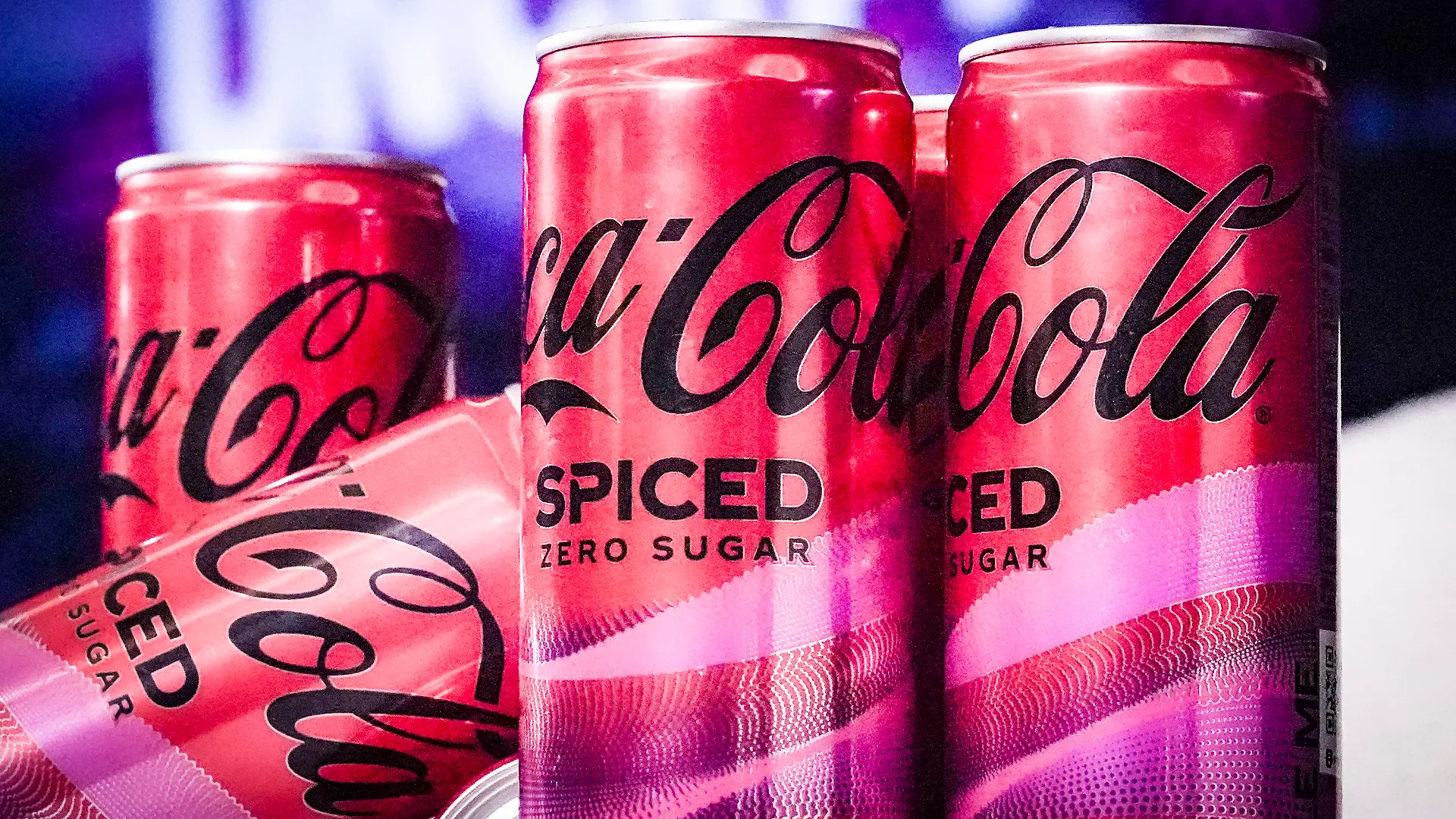 Cans of Coca-Cola Spiced, the beverage company's first new permanent offering to its North American portfolio in three years, are introduced at a livestream media event, Tuesday, Feb. 6, 2024, in New York. (AP Photo/Bebeto Matthews)