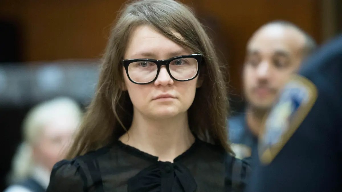 FILE - In this April 25, 2019, file photo, Anna Sorokin, who claimed to be a German heiress, returns to the courtroom during her trial on grand larceny and theft of services charges in New York.    A state website shows that Sorokin was freed into parole on Thursday, Feb. 11, 2021. A Manhattan jury found Sorokin guilty in 2019 of grand larceny and other charges accusing her of tricking people into believing she was an heiress with a fortune of about $67 million.  (AP Photo/Mary Altaffer, File)