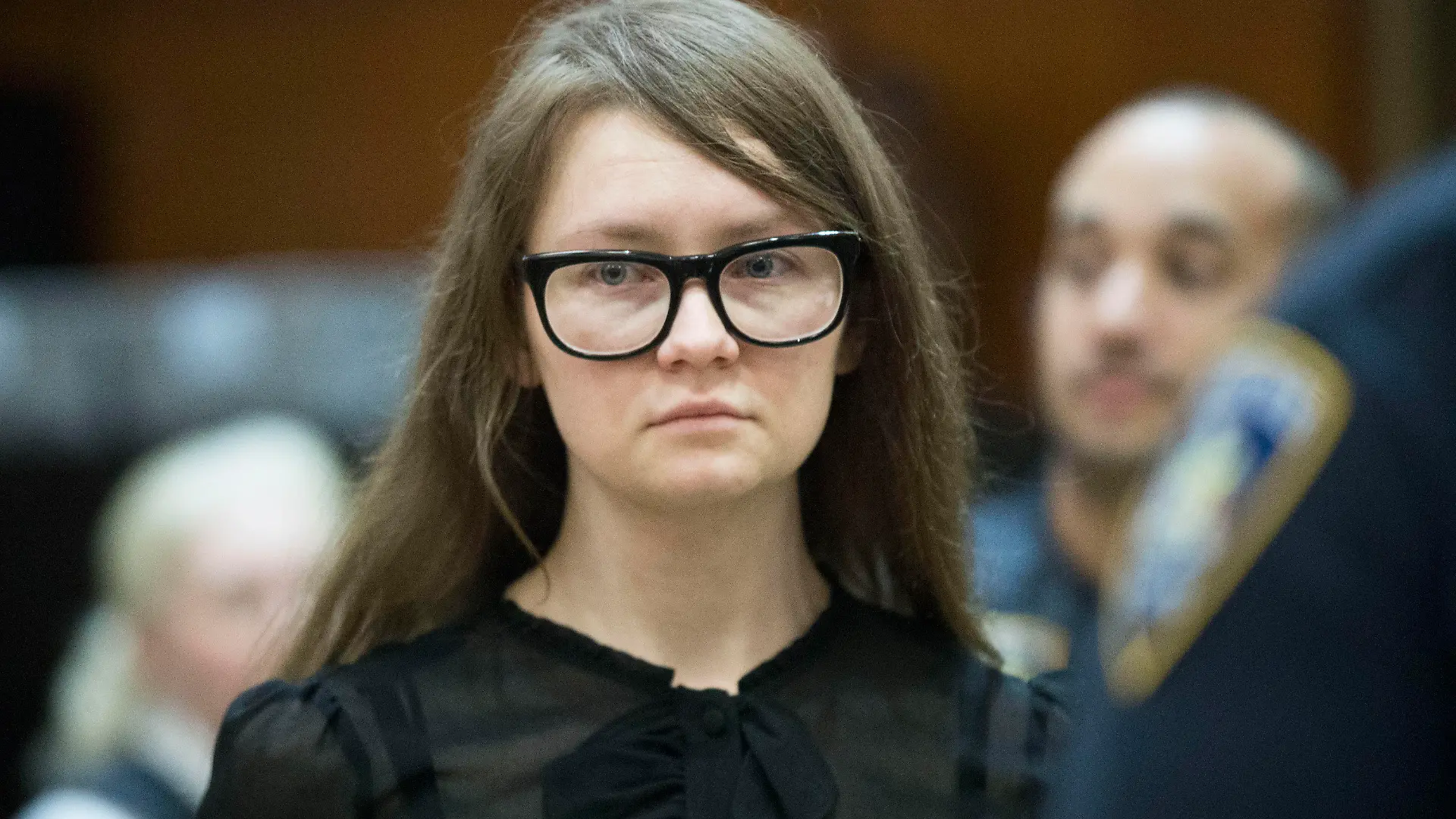 FILE - In this April 25, 2019, file photo, Anna Sorokin, who claimed to be a German heiress, returns to the courtroom during her trial on grand larceny and theft of services charges in New York. A state website shows that Sorokin was freed into parole on Thursday, Feb. 11, 2021. A Manhattan jury found Sorokin guilty in 2019 of grand larceny and other charges accusing her of tricking people into believing she was an heiress with a fortune of about $67 million. (AP Photo/Mary Altaffer, File)