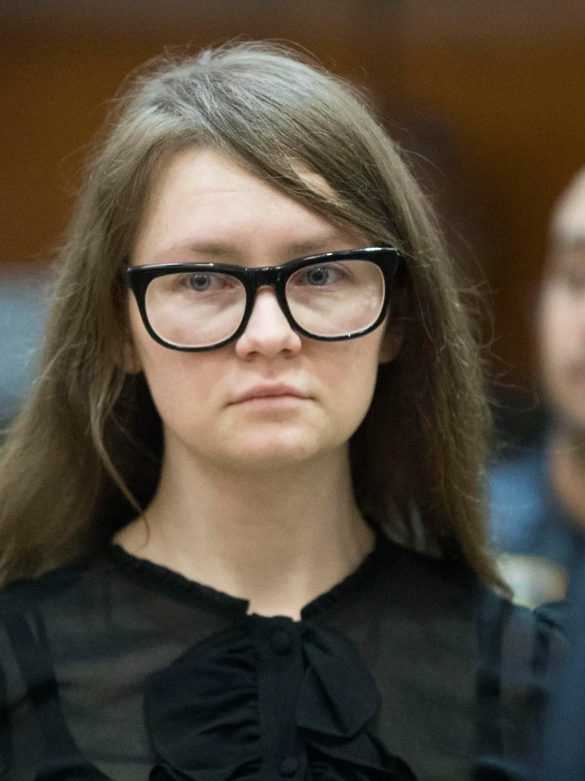 FILE - In this April 25, 2019, file photo, Anna Sorokin, who claimed to be a German heiress, returns to the courtroom during her trial on grand larceny and theft of services charges in New York.    A state website shows that Sorokin was freed into parole on Thursday, Feb. 11, 2021. A Manhattan jury found Sorokin guilty in 2019 of grand larceny and other charges accusing her of tricking people into believing she was an heiress with a fortune of about $67 million.  (AP Photo/Mary Altaffer, File)