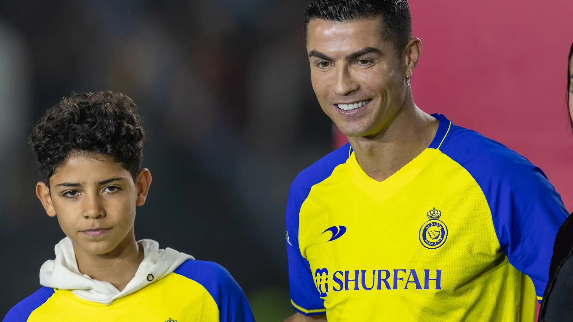 RIYADH, SAUDI ARABIA - JANUARY 03: Cristiano Ronaldo accompanied by his partner Georgina Rodriguez and his son Cristiano Ronaldo Jr, greet the crowd during the official unveiling of Cristiano Ronaldo as an Al Nassr player at Mrsool Park Stadium on January 3, 2023 in Riyadh, Saudi Arabia. (Photo by Yasser Bakhsh/Getty Images)