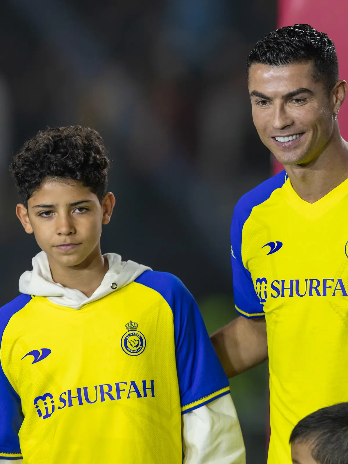 RIYADH, SAUDI ARABIA - JANUARY 03: Cristiano Ronaldo accompanied by his partner Georgina Rodriguez and his son Cristiano Ronaldo Jr, greet the crowd during the official unveiling of Cristiano Ronaldo as an Al Nassr player at Mrsool Park Stadium on January 3, 2023 in Riyadh, Saudi Arabia. (Photo by Yasser Bakhsh/Getty Images)