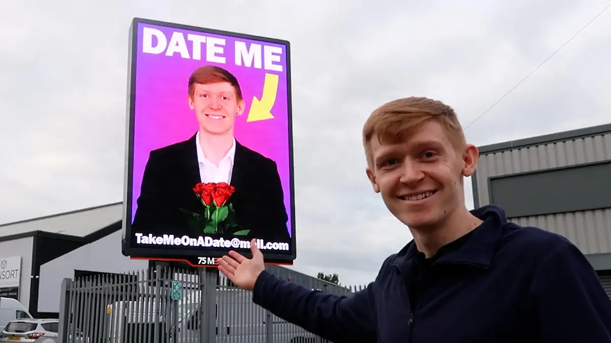 CATERS NEWS (PICTURED Ed photographed with his billboard) Meet the man who's never been on a date and is 'advertising' himself on a billboard in a bid to bag himself a girlfriend. Ed Chapman, 23, from Leeds, West Yorks, has been single all his life and decided it was time to step outside of the box and use a different avenue in his bid to find love. After having no luck with mainstream methods such as dating apps, Ed decided he wanted to promote himself on a giant billboard in Leeds in hope of finally being able to go on his very first date. Ed says he's received an influx of messages from people between the ages of 18 and 48 and is now busy arranging his first ever date. SEE CATERS COPY