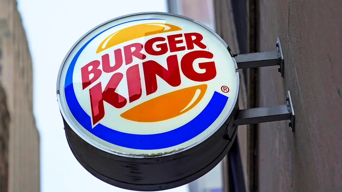 FILE - The Burger King logo is displayed on a sign outside a restaurant in downtown Pittsburgh on Wednesday, Jan. 12, 2022. On Friday, Sept. 9, 2022, the company said it plans to invest $400 million in its U.S. restaurants over the next two years to update its stores and boost flagging sales. (AP Photo/Gene J. Puskar, File)
