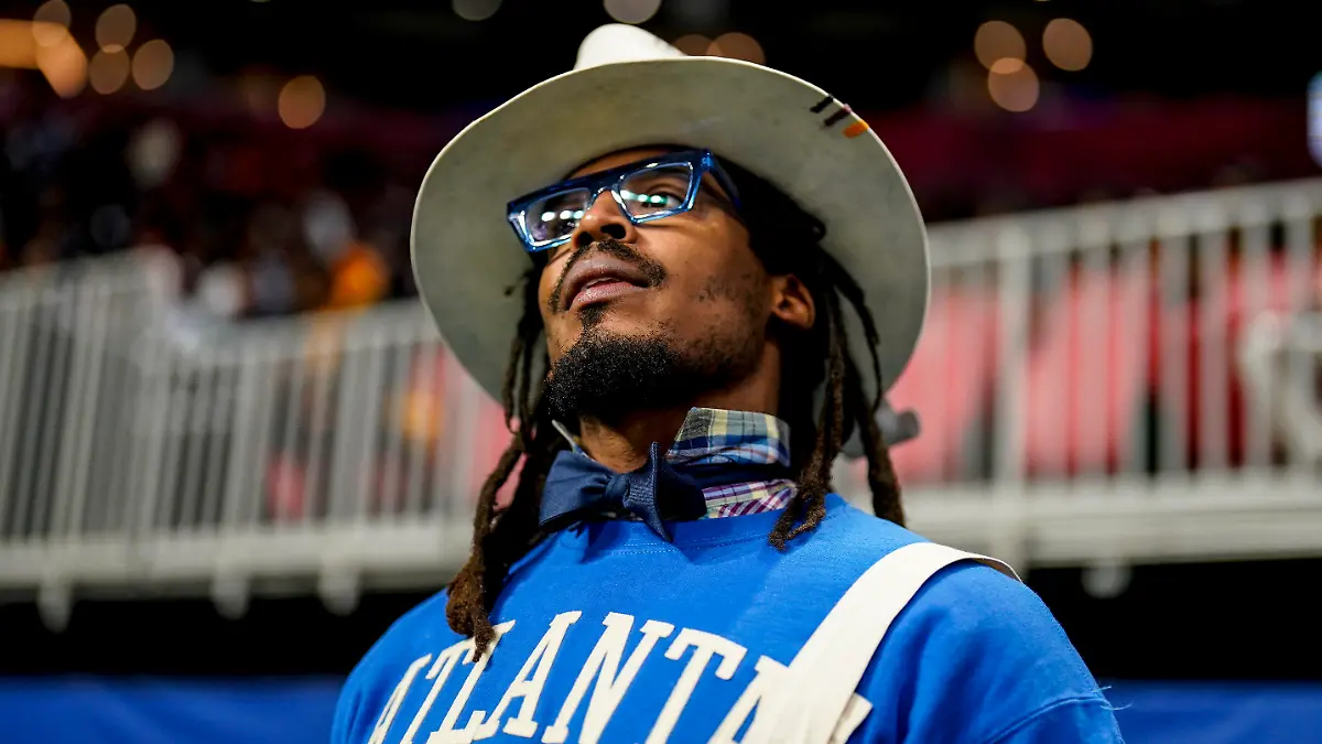 FILE - NFL football player Cam Newton watches play between Howard and Florida A&M during the first half of an NCAA Celebration Bowl football game, Dec. 16, 2023, in Atlanta. A video surfaced Sunday, Feb. 25, 2024, that appeared to show Newton being involved in a scuffle at a 7-on-7 youth football tournament in Atlanta. (AP Photo/Mike Stewart, File)