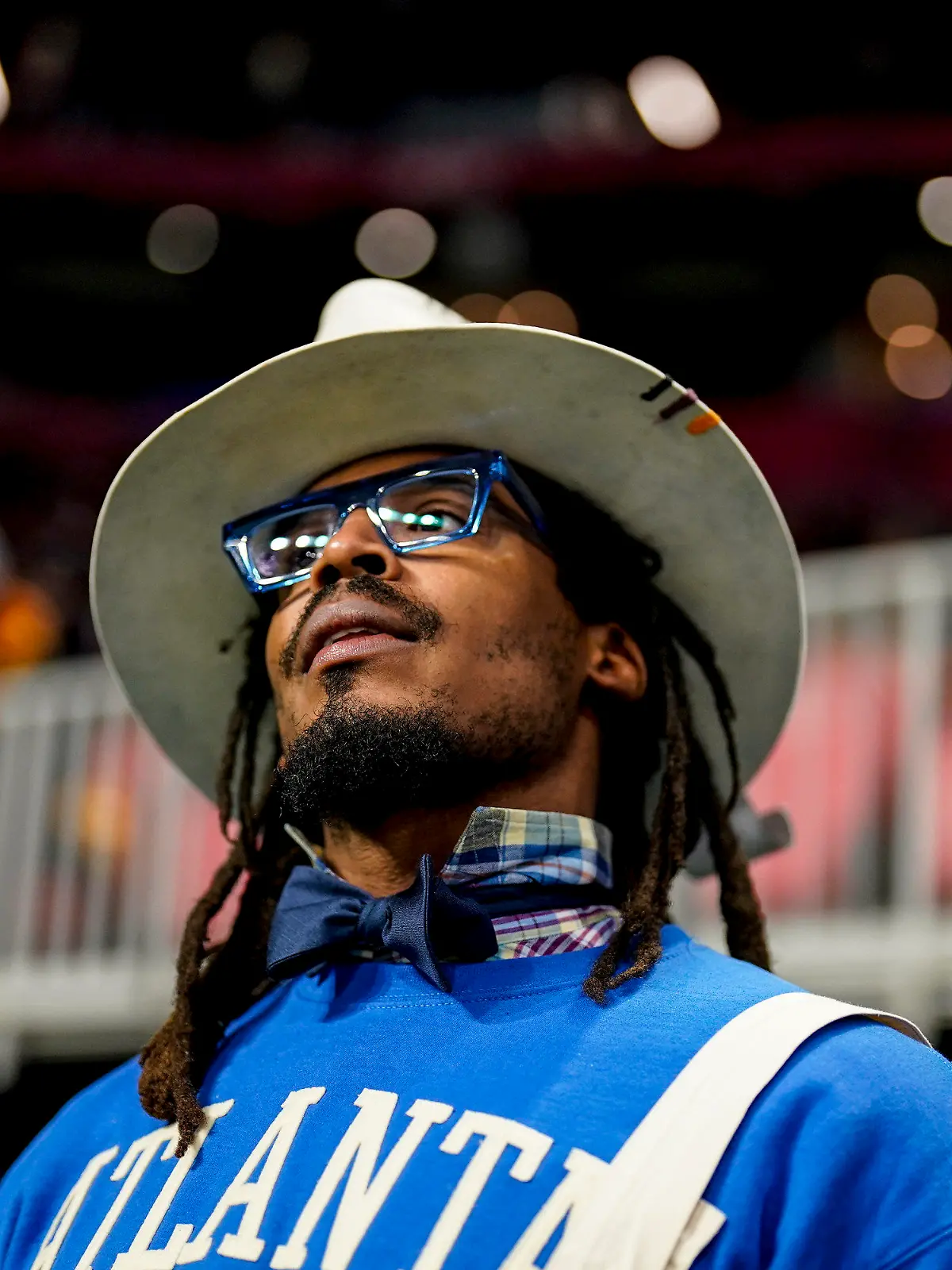FILE - NFL football player Cam Newton watches play between Howard and Florida A&M during the first half of an NCAA Celebration Bowl football game, Dec. 16, 2023, in Atlanta. A video surfaced Sunday, Feb. 25, 2024, that appeared to show Newton being involved in a scuffle at a 7-on-7 youth football tournament in Atlanta. (AP Photo/Mike Stewart, File)