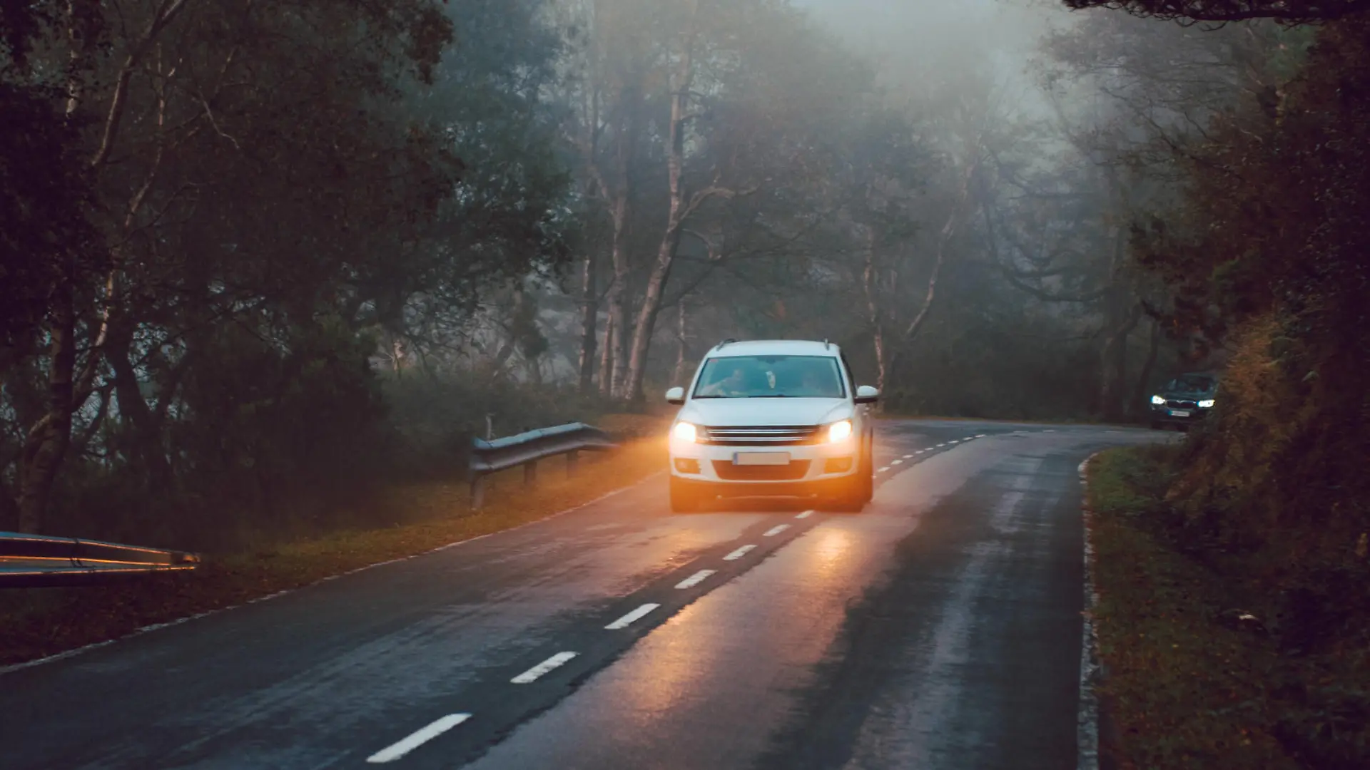 Close-up of a car alone on a road surrounded by trees and mountains AlbertoMenendez_WomanInHayedo_80 Copyright: xAlbertoxMenendezzx