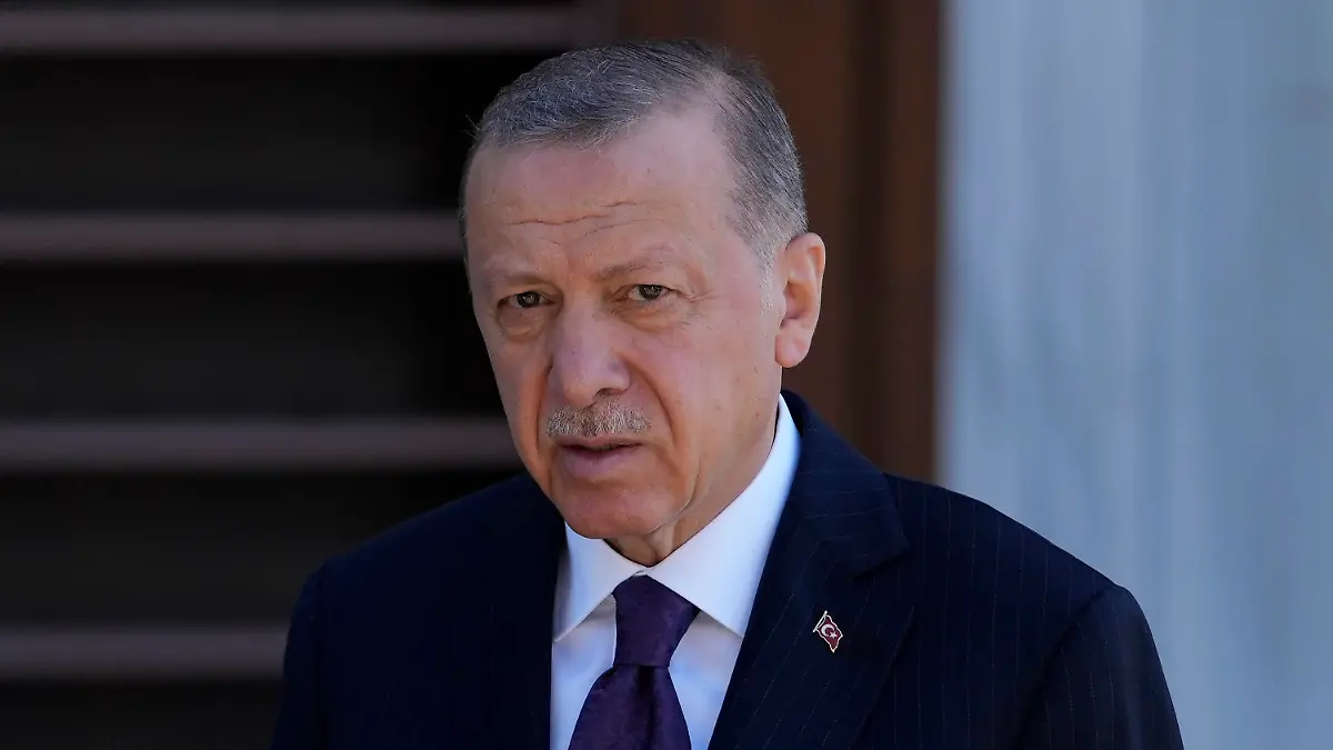 Turkish President Recep Tayyip Erdogan speaks to the media following the Friday noon Prayer in Istanbul, Turkey, Friday, Sept. 9, 2022. Erdogan said he would like to attend the funeral of Queen Elizabeth providing his schedule permits it. Erdogan told reporters Friday that he knew the queen and had met her at Buckingham Palace twice. "If we find the opportunity we would like to be present at this ceremony," he said. Queen Elizabeth II, Britain's longest-reigning monarch, died Thursday after 70 years on the throne. She was 96. (AP Photo/Khalil Hamra)