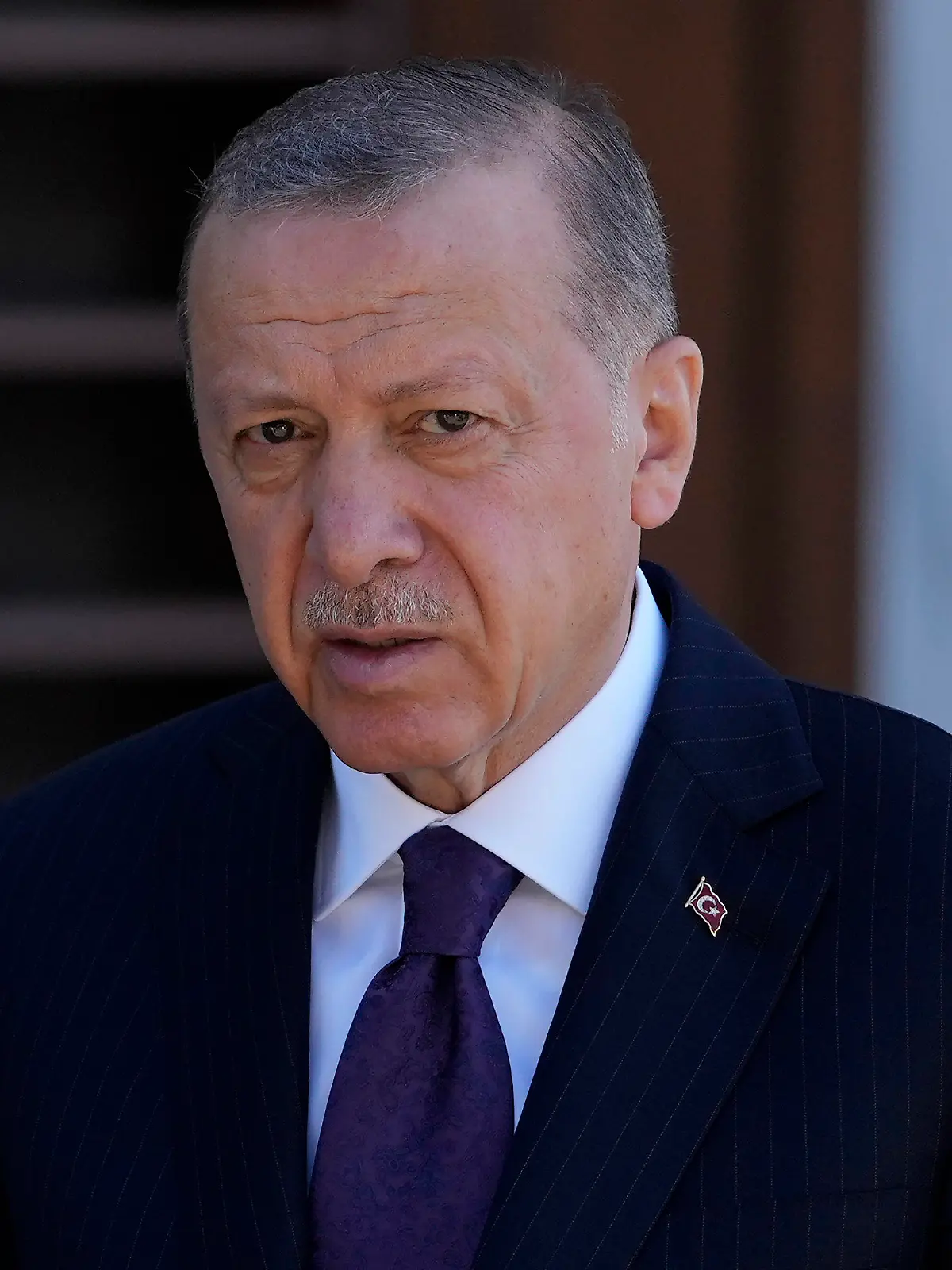 Turkish President Recep Tayyip Erdogan speaks to the media following the Friday noon Prayer in Istanbul, Turkey, Friday, Sept. 9, 2022. Erdogan said he would like to attend the funeral of Queen Elizabeth providing his schedule permits it. Erdogan told reporters Friday that he knew the queen and had met her at Buckingham Palace twice. "If we find the opportunity we would like to be present at this ceremony," he said. Queen Elizabeth II, Britain's longest-reigning monarch, died Thursday after 70 years on the throne. She was 96. (AP Photo/Khalil Hamra)