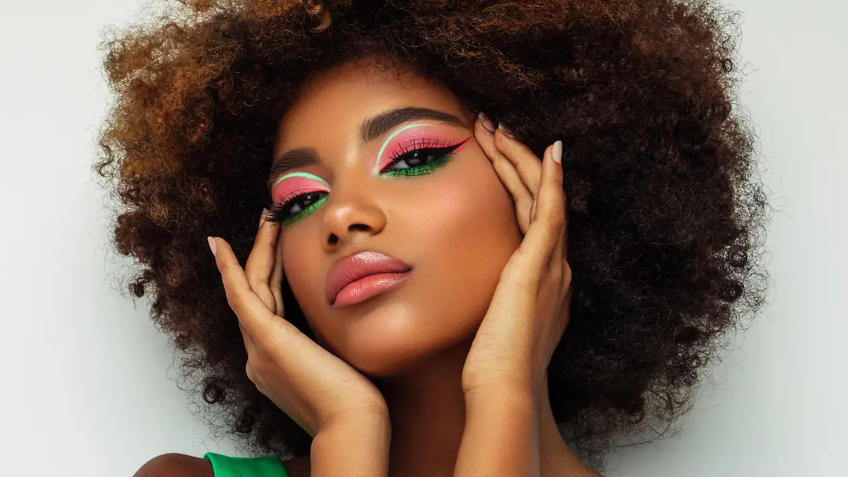 Portrait of young afro woman with bright make-up