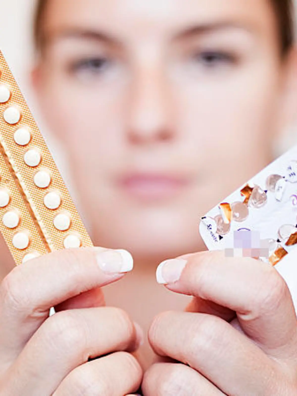 Young woman with contraceptive pills, birth-control pill, blister pack of combined oral contraceptive pills, birth control, prevention of pregnancy. (CTK Photo/Josef Horazny, Martin Sterba)