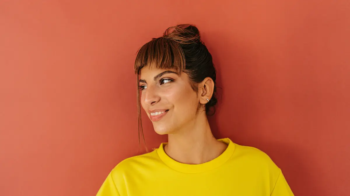 Portrait of a smiling teenage girl, isolated