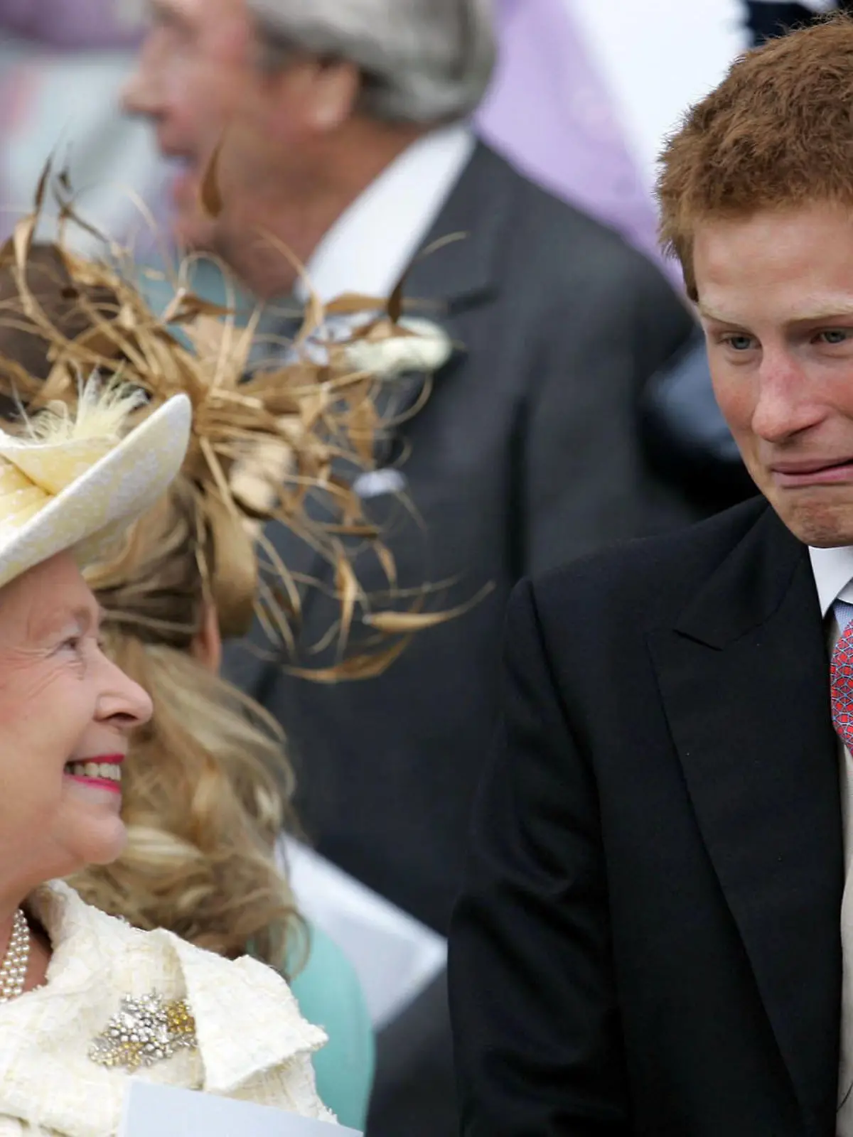 Britain's Queen Elizaberth II looks round to Prince Harry as they watch Prince Charles and his bride Camilla Duchess of Cornwall following the wedding of prince Charles and Camilla Parker Bowles at St. George's Chapel in Windsor Castle, 9 April 2005. Empics / Alastair Grant +++(c) dpa - Report+++