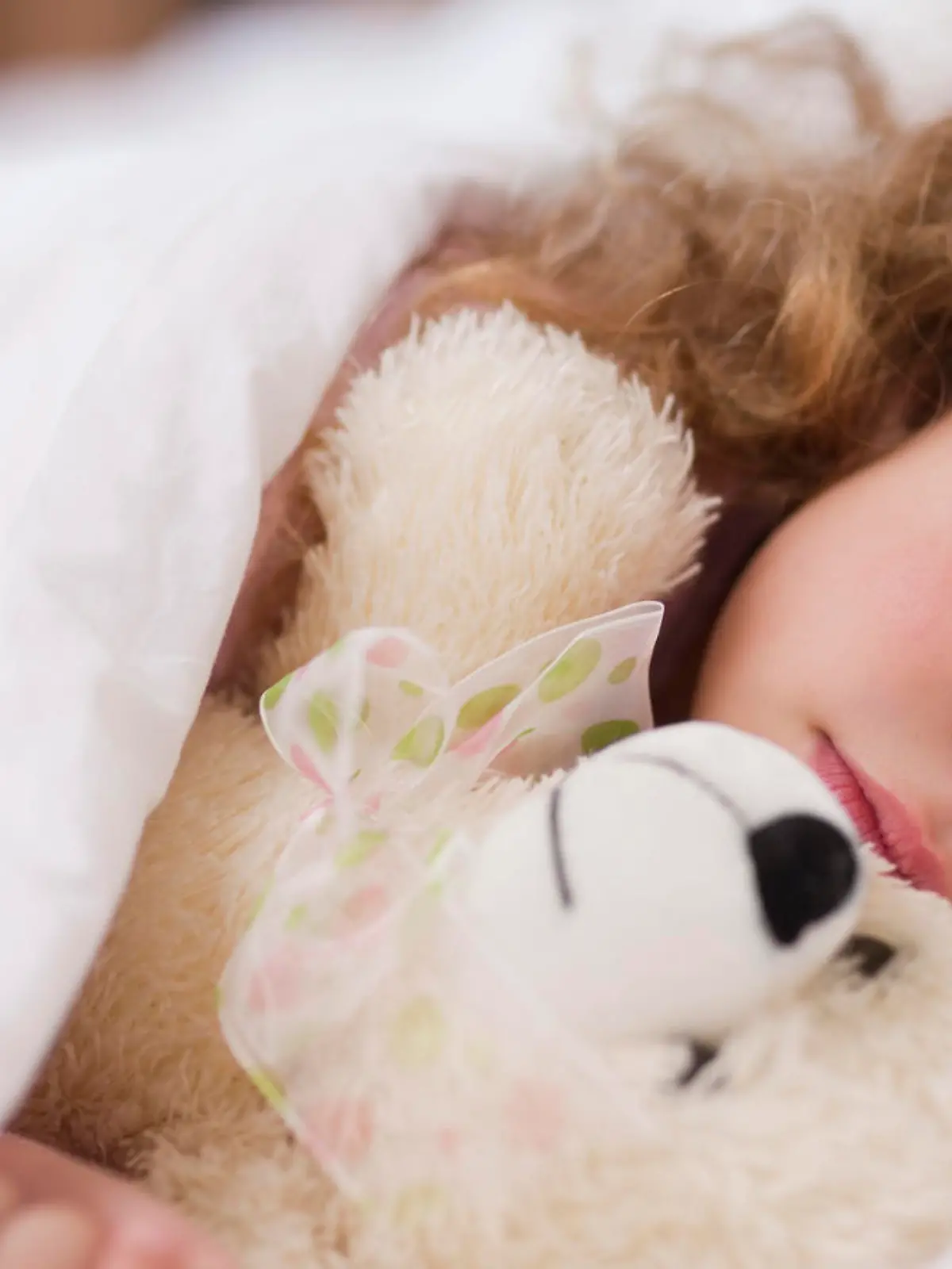 Little girl sleeping with her daddy
