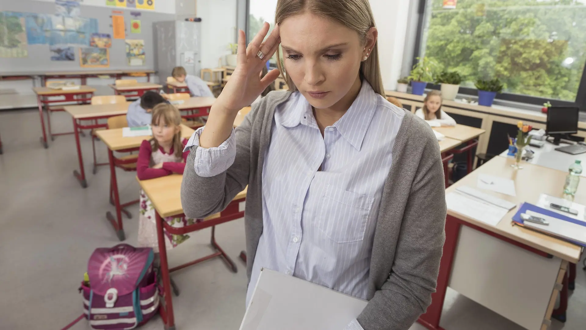 Female teacher looking stressed in classroom, Munich, Bavaria, Germany mit_2017_00302
Female Teacher Looking stressed in Classroom Munich Bavaria Germany mit_2017_00302