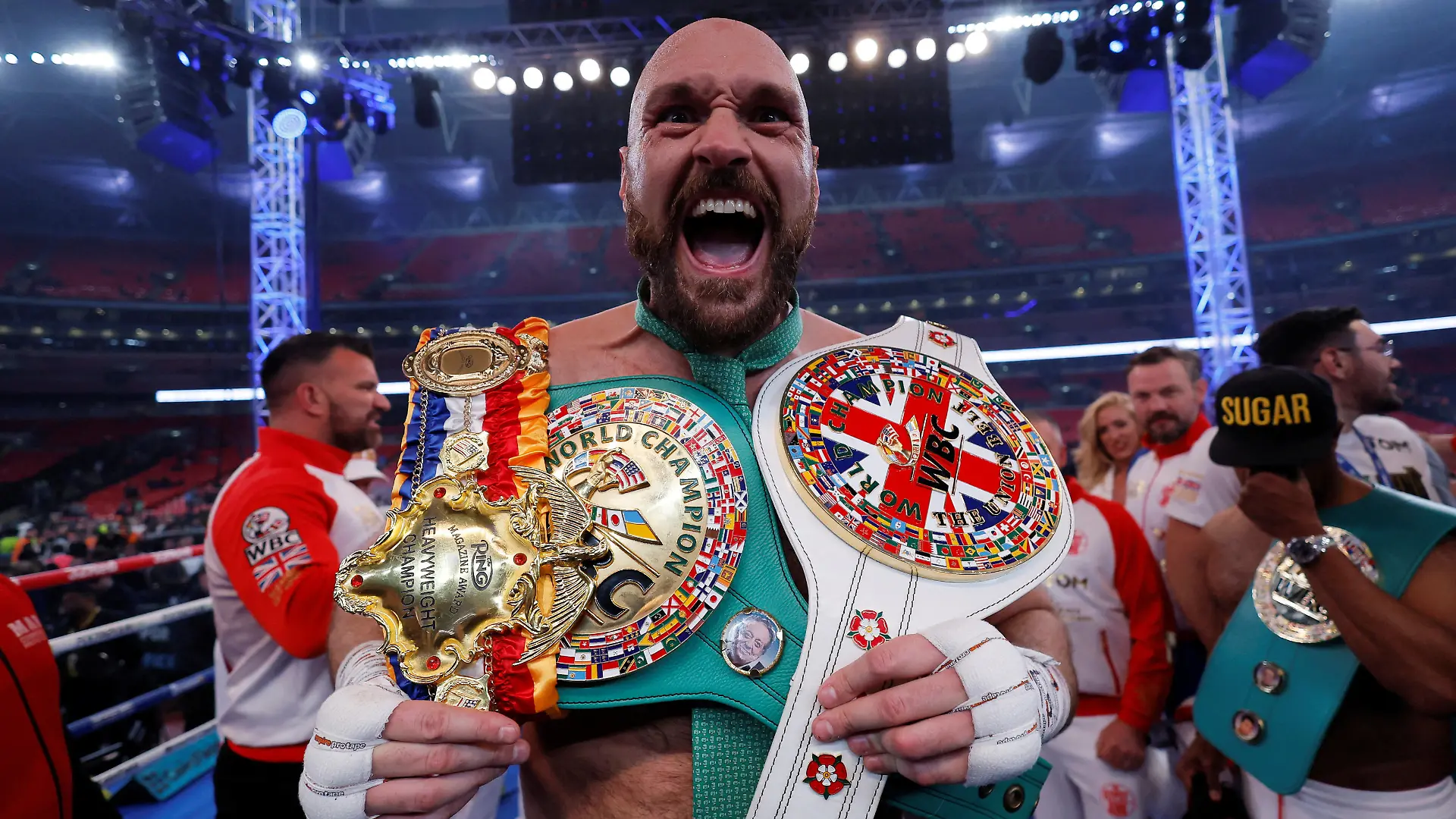 FILE PHOTO: Boxing - Tyson Fury v Dillian Whyte - WBC World Heavyweight Title - Wembley Stadium, London, Britain - April 23, 2022  Tyson Fury celebrates with the belts after winning his fight against Dillian Whyte Action Images via Reuters/Andrew Couldridge/File Photo