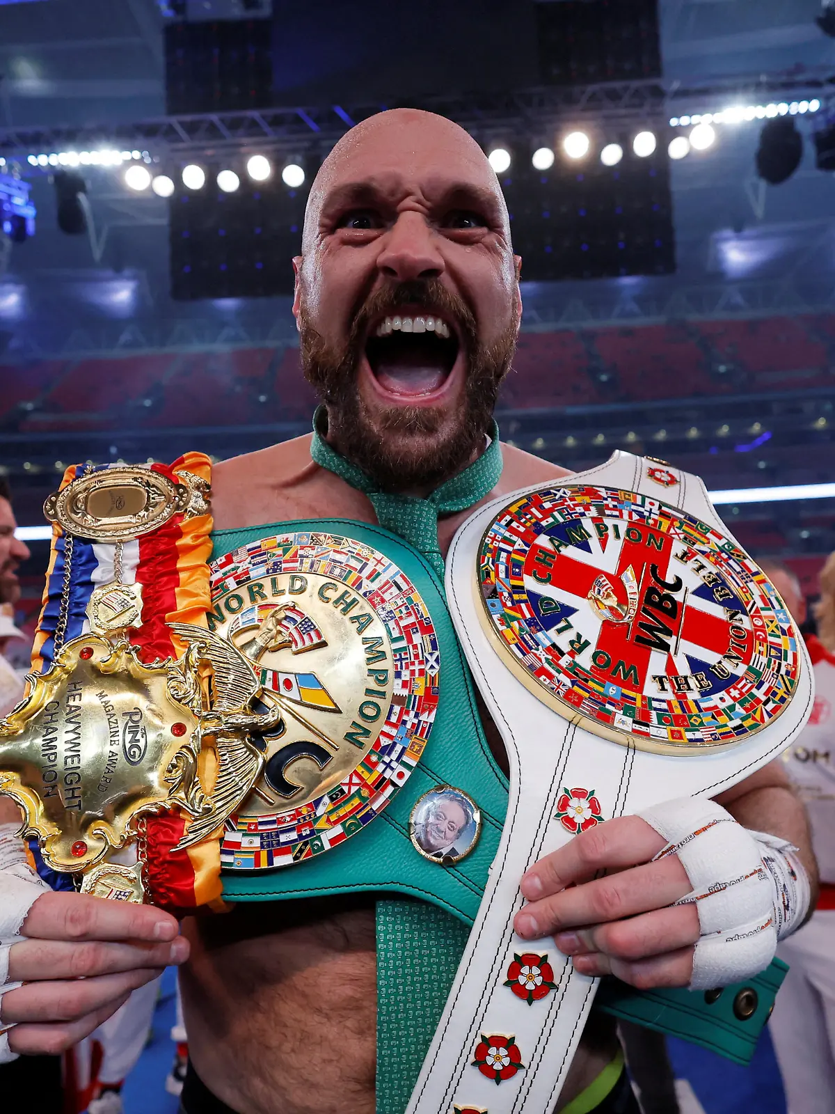 FILE PHOTO: Boxing - Tyson Fury v Dillian Whyte - WBC World Heavyweight Title - Wembley Stadium, London, Britain - April 23, 2022  Tyson Fury celebrates with the belts after winning his fight against Dillian Whyte Action Images via Reuters/Andrew Couldridge/File Photo