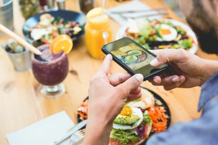 Influencer,Man,Eating,Brunch,While,Making,Video,And,Photos,Of