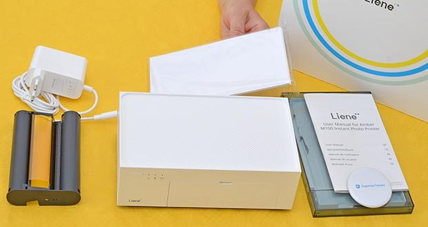 Liene 10X15 WiFi Fotodrucker im Test - Lieferumfang: Fotodrucker, Papierkassette, Netzadapter, Farbband, 20 Stück Fotopapier, Bedienungsanleitung